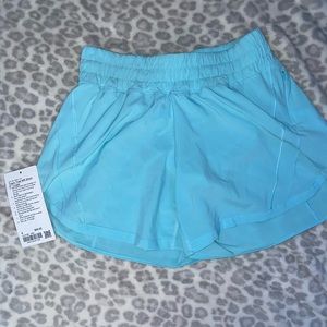 Lululemon track that 5 inch shorts size 8 in the color icing blue